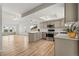 Spacious kitchen with an island, stainless steel appliances, and hardwood floors at 381 Mountain Cloud Cir, Highlands Ranch, CO 80126