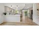 Stylish kitchen with stainless steel appliances, hardwood floors, subway tile backsplash and breakfast bar at 381 Mountain Cloud Cir, Highlands Ranch, CO 80126
