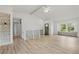 Airy living room with hardwood floors, natural light, stylish railings and a built-in bookcase at 381 Mountain Cloud Cir, Highlands Ranch, CO 80126