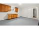 Storage room featuring wooden cabinets, neutral walls, and ample space for organization and storage at 381 Mountain Cloud Cir, Highlands Ranch, CO 80126