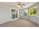 Cozy sun room with sliding glass doors and large windows offering a view of the outdoors at 381 Mountain Cloud Cir, Highlands Ranch, CO 80126