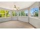 Bright sun room with multiple windows offering natural light and views of the surrounding greenery at 381 Mountain Cloud Cir, Highlands Ranch, CO 80126