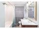 Updated bathroom with double vanity and shower/tub combo at 4675 Reed St, Wheat Ridge, CO 80033