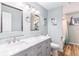 Bathroom boasts double sinks, marble countertops, and updated fixtures at 4675 Reed St, Wheat Ridge, CO 80033