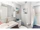 Basement bathroom includes a shower, toilet, and updated vanity at 4675 Reed St, Wheat Ridge, CO 80033