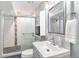 Updated bathroom with walk-in shower and modern vanity at 4675 Reed St, Wheat Ridge, CO 80033