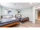 Basement bedroom with two beds and plenty of natural light at 4675 Reed St, Wheat Ridge, CO 80033