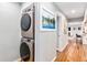 Stackable washer and dryer in a well-lit laundry room at 4675 Reed St, Wheat Ridge, CO 80033