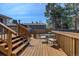 Enjoy outdoor dining on this wood back deck with outdoor furniture at 3785 S Benton Way, Denver, CO 80235