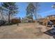 Spacious backyard with wood fence, grill, and fire pit, ideal for outdoor entertaining at 3785 S Benton Way, Denver, CO 80235