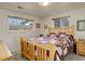 Comfortable bedroom with natural light from two windows at 3785 S Benton Way, Denver, CO 80235