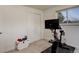 Functional exercise room with spin bike, closet and window at 3785 S Benton Way, Denver, CO 80235