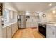 Renovated kitchen showcasing stainless steel appliances, ample cabinets, and stunning granite countertops at 3785 S Benton Way, Denver, CO 80235