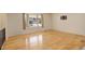 Sun-filled space with hardwood floors and a large bay window at 3785 S Benton Way, Denver, CO 80235