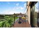 Balcony with a table and chairs, offering views of the surrounding landscape and blue skies at 4625 W 50Th Ave # 309, Denver, CO 80212
