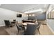 Inviting game room with a pool table, card tables, and lounge seating beneath stylish pendant lights at 4625 W 50Th Ave # 309, Denver, CO 80212