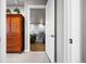Hallway with carpet and wooden floors viewed from an open doorway at 4625 W 50Th Ave # 309, Denver, CO 80212
