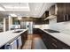 Beautiful, modern kitchen with stainless steel appliances, marble backsplash, and quartz countertops at 4625 W 50Th Ave # 309, Denver, CO 80212