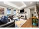 Comfortable living room with a stone fireplace and plenty of natural light at 4625 W 50Th Ave # 309, Denver, CO 80212