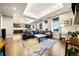 Spacious living room features ample seating, a large rug, and recessed lighting at 4625 W 50Th Ave # 309, Denver, CO 80212
