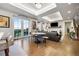 Open floor plan with dining area, living room, and balcony access for seamless indoor-outdoor living at 4625 W 50Th Ave # 309, Denver, CO 80212