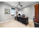 Office space with a large desk and a ceiling fan at 4625 W 50Th Ave # 309, Denver, CO 80212