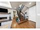 Interior view of a staircase with hardwood floors, modern lighting, and access to multiple levels of the home at 4625 W 50Th Ave # 309, Denver, CO 80212