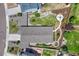 Aerial view showcasing the home's roof, landscaping, and inviting backyard with a fire pit area at 177 Vista Cliff Cir, Castle Rock, CO 80104