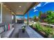 Relaxing back patio features a hot tub, outdoor seating and a beautifully landscaped backyard at 177 Vista Cliff Cir, Castle Rock, CO 80104