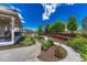 Spacious backyard featuring a manicured lawn and landscaped area leading to a covered patio at 177 Vista Cliff Cir, Castle Rock, CO 80104