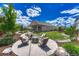 Backyard oasis with manicured landscaping and an inviting fire pit area with outdoor seating at 177 Vista Cliff Cir, Castle Rock, CO 80104