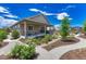Backyard oasis with manicured landscaping and a fire pit area. Covered patio provides shade at 177 Vista Cliff Cir, Castle Rock, CO 80104