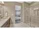 Bathroom featuring a single sink, granite countertops, and a glass-enclosed shower at 177 Vista Cliff Cir, Castle Rock, CO 80104