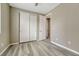 Bedroom with wood-look floors, closet, and a neutral color palette provides a modern feel at 177 Vista Cliff Cir, Castle Rock, CO 80104