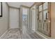 Warm entryway featuring wood-look floors and a unique mirror adding character and style to the space at 177 Vista Cliff Cir, Castle Rock, CO 80104