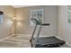 Exercise room featuring a window, gray walls, and wood-style flooring at 177 Vista Cliff Cir, Castle Rock, CO 80104