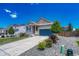 Lovely home with gray siding, stone accents, a two-car garage, and a well-manicured front yard with mature trees at 177 Vista Cliff Cir, Castle Rock, CO 80104