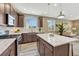 Well-lit kitchen with stainless appliances, granite countertops, and a seamless connection to the living area at 177 Vista Cliff Cir, Castle Rock, CO 80104