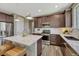 Bright kitchen features stainless steel appliances, an island, and sleek countertops at 177 Vista Cliff Cir, Castle Rock, CO 80104