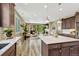 Modern kitchen connects to a living room and has stainless steel appliances and plenty of cabinets at 177 Vista Cliff Cir, Castle Rock, CO 80104