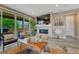 Inviting living room with a fireplace, comfortable seating, and sliding glass doors to the backyard at 177 Vista Cliff Cir, Castle Rock, CO 80104