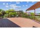 Expansive back deck with pergola, ideal for outdoor entertaining and enjoying scenic views at 10448 Kicking Horse Dr, Littleton, CO 80125