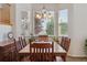 Dining area with large windows offering ample natural light and views at 10448 Kicking Horse Dr, Littleton, CO 80125