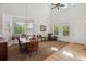 Dining area with carpeted floors, natural light, and a large picture window at 10448 Kicking Horse Dr, Littleton, CO 80125