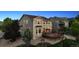 Charming exterior view of home featuring a spacious back deck with pergola and manicured landscaping at 10448 Kicking Horse Dr, Littleton, CO 80125