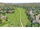 Aerial view of the community with green space and walking path at 848 Huntington Pl, Highlands Ranch, CO 80126