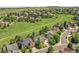 Picturesque aerial view of a suburban neighborhood with green spaces and walking path at 848 Huntington Pl, Highlands Ranch, CO 80126