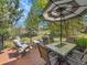 Cozy back deck with comfortable seating and umbrella at 848 Huntington Pl, Highlands Ranch, CO 80126
