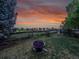 Cozy backyard space with a fire pit and wooden fence, ideal for relaxing evenings at 848 Huntington Pl, Highlands Ranch, CO 80126