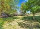 Spacious backyard featuring a deck and mature trees at 848 Huntington Pl, Highlands Ranch, CO 80126